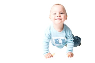 One year old kid on the floor, isolated over white background