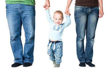 One year old boy holding hands of parents, isolated over white background