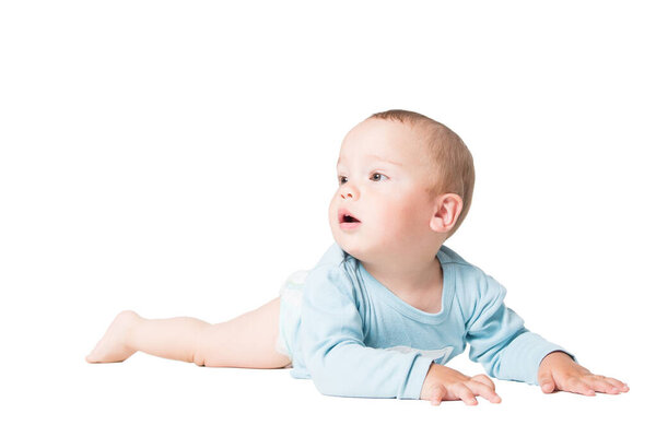 Small adorable one year old kid lying, isolated over white background