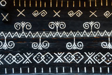 painted pattern on side of log house in Cicmany, UNESCO World Heritage Site, Slovakia