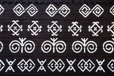 painted pattern on side of log house in Cicmany, UNESCO World Heritage Site, Slovakia