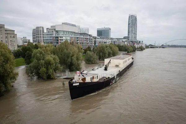 stock image BRATISLAVA, SLOVAKIA - SEP 17, 2024: High water on Danube river by the Eurovea Embarkment, Bratislava, Slovakia