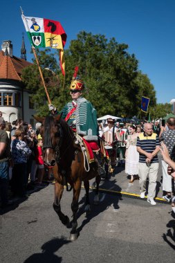 PEZINOK, SLOVAKIA - SEP 22, 2024: Allegorical procession as part of traditional thanksgiving wine harvest celebration and costume parade in Pezinok, Slovakia clipart