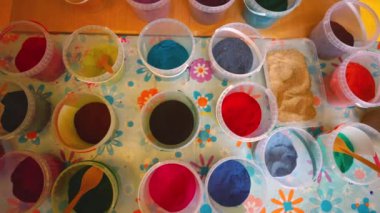 Colored sand in plastic containers, perfect for art and crafts