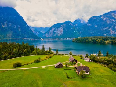 Scenery of beautiful Austria village Obertraun Lake Hallstatt in Salzkammergut. Landscape of Austrian Alps with traditional alpine houses clipart