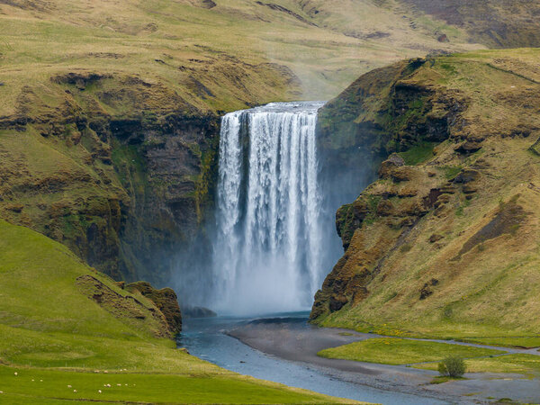 Majestic view of Skogafoss waterfall in Iceland. a famous natural landmark and travel destination.