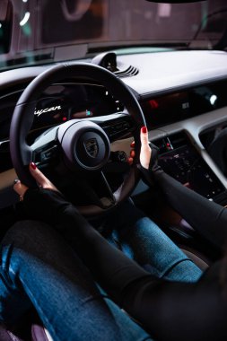 Berlin, Germany, May 1, 2024: closeup steering wheel, Interior, cockpit of Porsche Taycan Turbo S battery-electric sports Car clipart