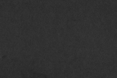 Arkaplan için siyah doku. Siyah kağıdı kapat. Renkleri süsle. Siyah ve soluk beyaz.