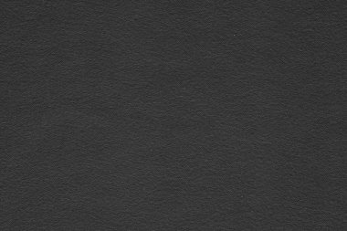 Arkaplan için siyah doku. Siyah kağıdı kapat. Renkleri süsle. Siyah ve soluk beyaz.