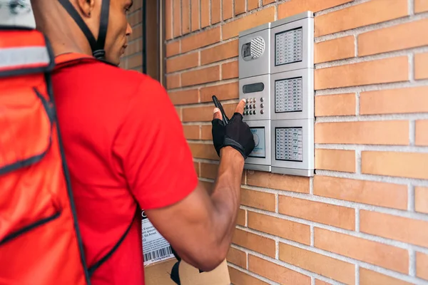 African American Delivery Man Calling Door Intercom Order Deliver Package — Stock Photo, Image