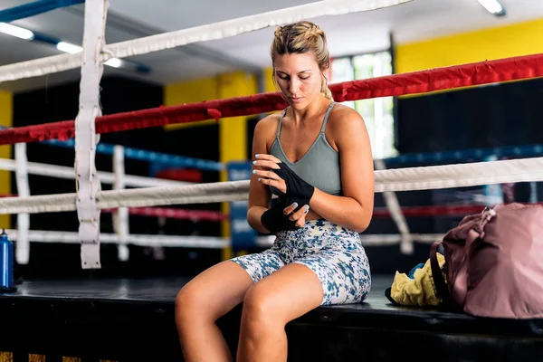 Caucasian Young Woman Sitting Boxing Ring Wrapping Hands Black Boxing — Stock Photo, Image