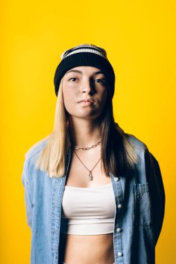 Stock photo of young pretty girl looking at camera in studio.