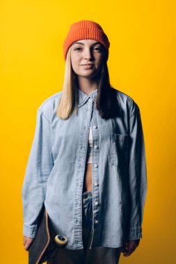 Stock photo of young pretty girl looking at camera in studio.