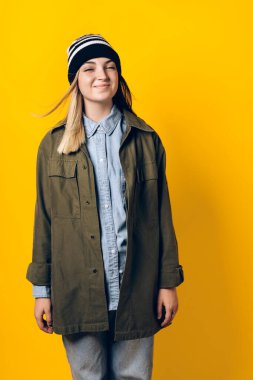 Stock photo of young smiley girl looking at camera in studio.