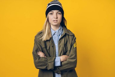Stock photo of young pretty girl looking at camera in studio.