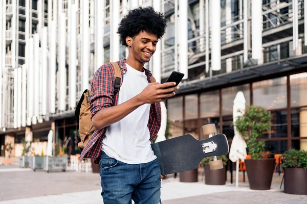 Stock Photo Young Afro Boy Walking City Carrying His Longboard Stock Image