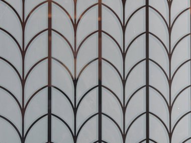 Üst üste binen kemerli soyut geometrik desen yakın plan.