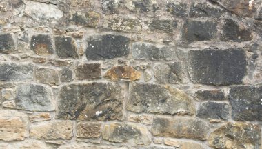 Arka plan ya da doku olarak kullanılacak eski taş duvar. Eski şehrin antik duvarı..