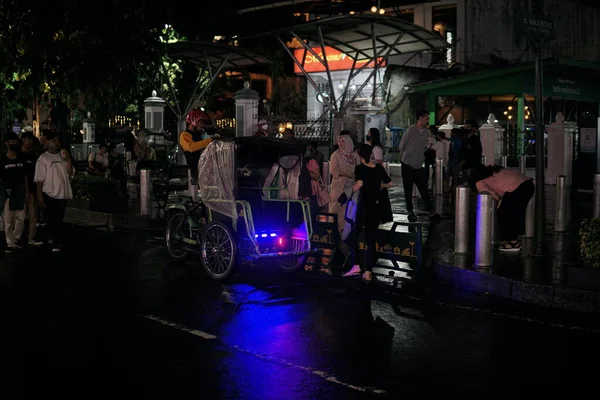 stock image the atmosphere of the Malioboro street in Yogyakarta is bustling and romantic at night. Jalan Malioboro is a favorite tourist attraction in Yogyakarta