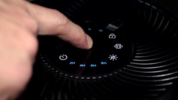 Man Hand Turns Air Purifier Regulating Fan Speed — Stock Video