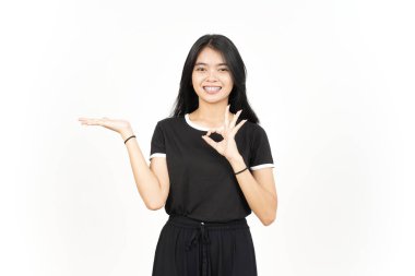Showing and Presenting Product on Open Palm with ok sign Of Beautiful Asian Woman Isolated On White
