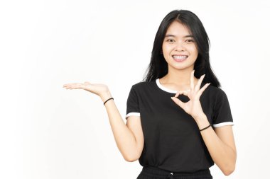 Showing and Presenting Product on Open Palm with ok sign Of Beautiful Asian Woman Isolated On White