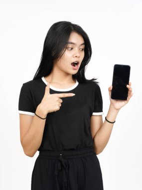 Showing blank smartphone screen with shocked face Of Beautiful Asian Woman Isolated On White