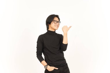 Presenting and Pointing Side Product Using Thumb Of Handsome Asian Man Isolated On White Background