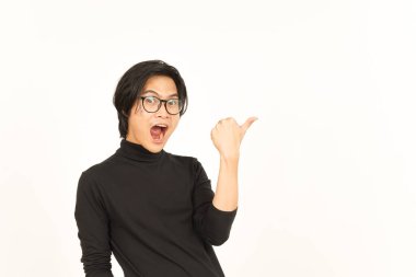 Presenting and Pointing Side Product Using Thumb Of Handsome Asian Man Isolated On White Background