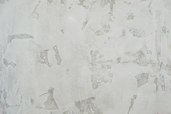 壁に灰色の斑点が付いている白い装飾的なプラスター テクスチャ — ストック写真