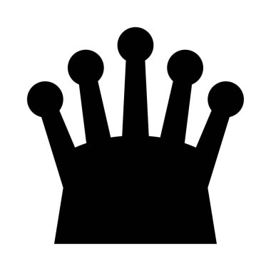 Üzerinde dört küçük siyah nokta olan bir taç.