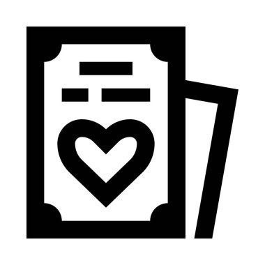 Bir kalp ve içinde bir sayfa olan bir kitap.