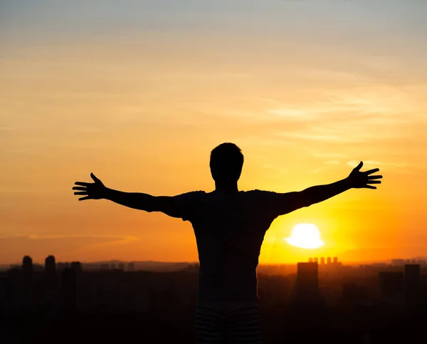 stock image Man with open arms to the sunset in Sao Paulo, Brazil