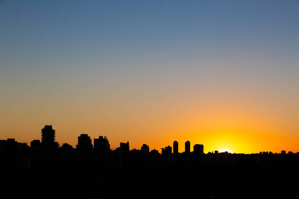 Sao Paulo city skyline during a sunset in summer.