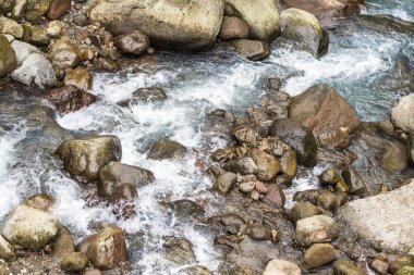 The awe-inspiring beauty of water in motion among the rocks of nature