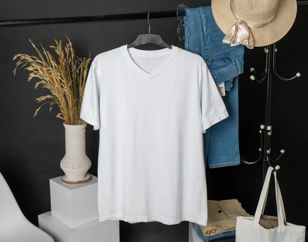 A v-neck shirt mockup with minimalistic decoration, beautifully hung to enhance its chic and sophisticated look