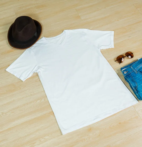 The flat lay v-neck shirt mockup highlights a clean and minimal design with subtle embellishments, adding a touch of sophistication to the garment
