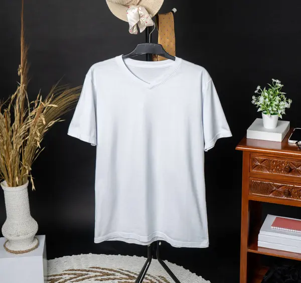 The mockup showcases a v-neck shirt with minimalist design, hung in a way that highlights its simple yet stylish appeal
