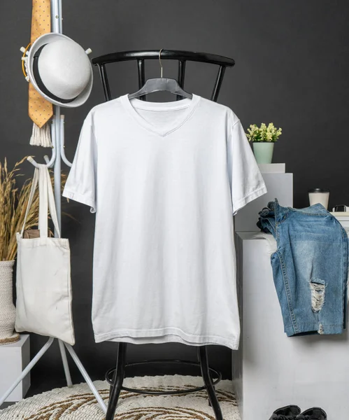 The v-neck shirt mockup presents a garment with minimalistic decoration, hanging in a manner that exudes sophistication and style