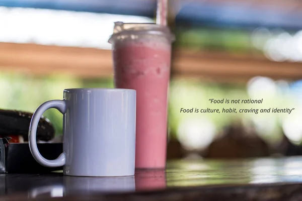 Food quote - Food is not rational. Food is culture, habit, craving and identity. With a white blank mug and a pink colored drinks