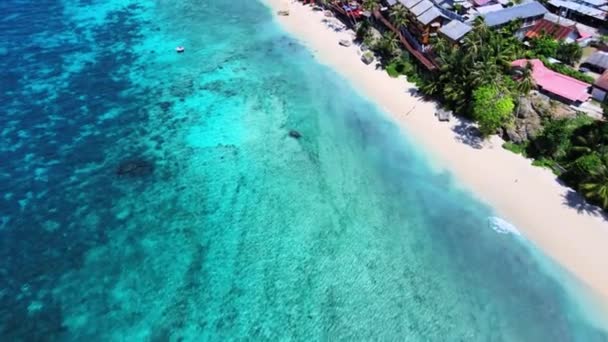stock video Aerial footage of the shoreline with the clear sky above it, taken with a drone