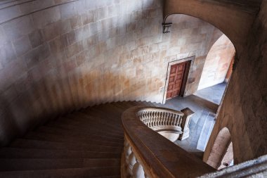 stairs of the circular courtyard of the The Palace of Charles V at the Alhambra in Granada, Spain