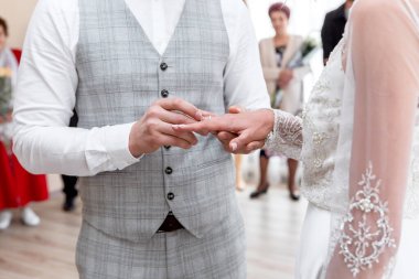 Hands of the bride and groom with wedding rings. The wedding ceremony. Love. Wedding rings