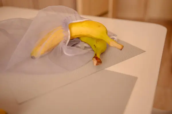 Bananas in eco friendly net bag