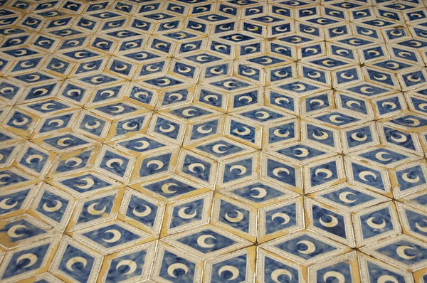 Beautiful pattern in a decorated floor with moon. Yellow and blue