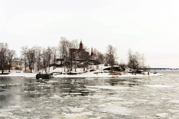 Snowed island at Helsinki coastline with a beautiful house. Finland