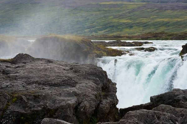 Close up of water flow at Godafoss waterfall. Iceland