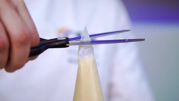 Male Pastry Chef Cuts Tip Cellophane Pastry Bag Custard Cooking — Stock Video