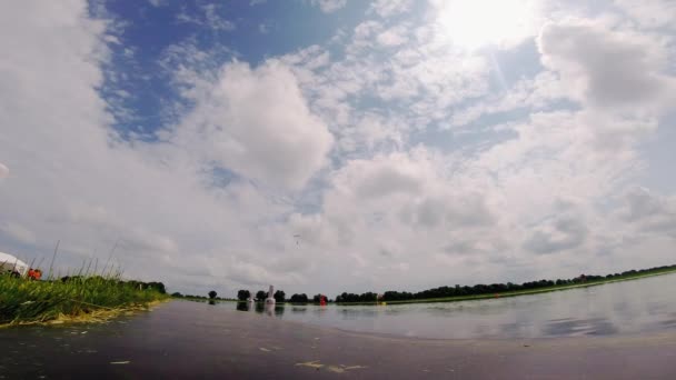Skydiver Flies Blue Parachute Lake Approaching Ground Sportsman Uses Parachute — Stock Video