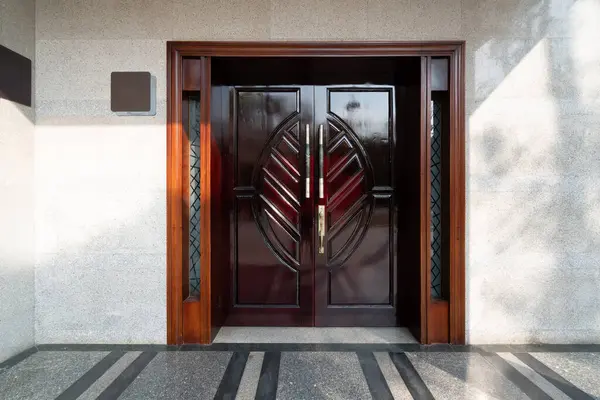 stock image Carved solid wood door for building entrance